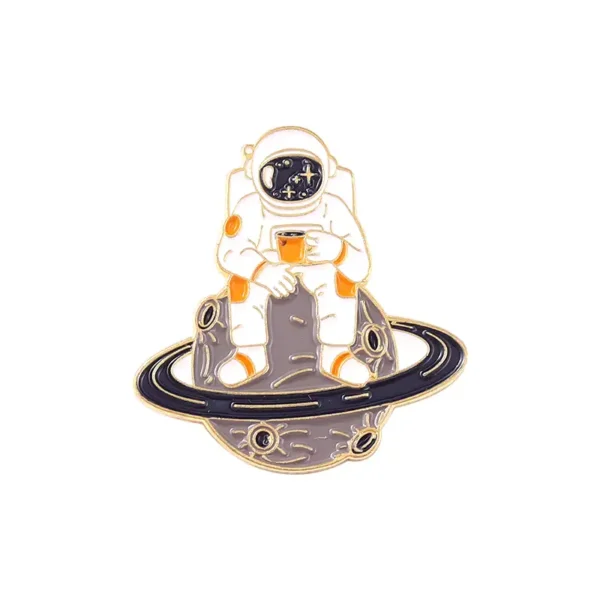 Astronaut in Space Pin with Planet Ring Design.