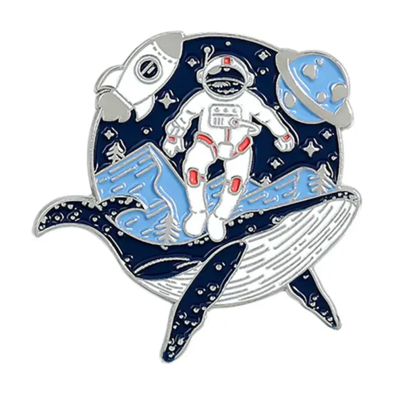 Enamel pin featuring an astronaut in space with planets and stars, perfect for science enthusiasts and space lovers.