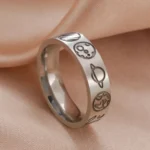 Astronomy-themed silver ring with planet and space motifs.