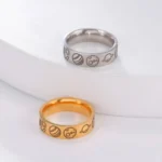 Silver and gold rings with scientific symbols and designs.