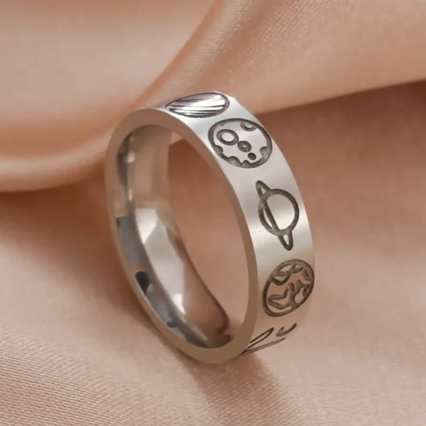 Astronomy-themed silver ring with planet and space motifs.