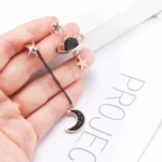 Unique celestial space-themed earrings with planets, stars, and moon charms. Perfect for astronomy lovers and space enthusiasts. Elegant jewelry accessory for everyday wear or special occasions.