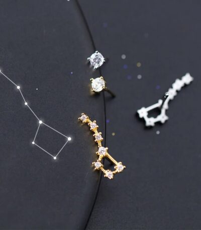 Elegant constellation-inspired jewelry with star-shaped and cubic zirconia accents.