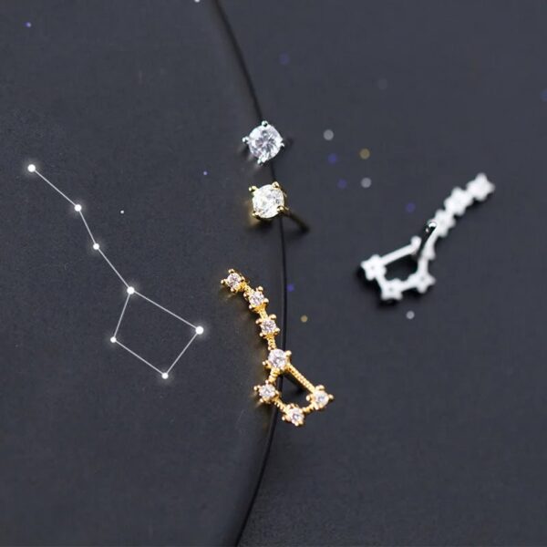 Elegant constellation-inspired jewelry with star-shaped and cubic zirconia accents.