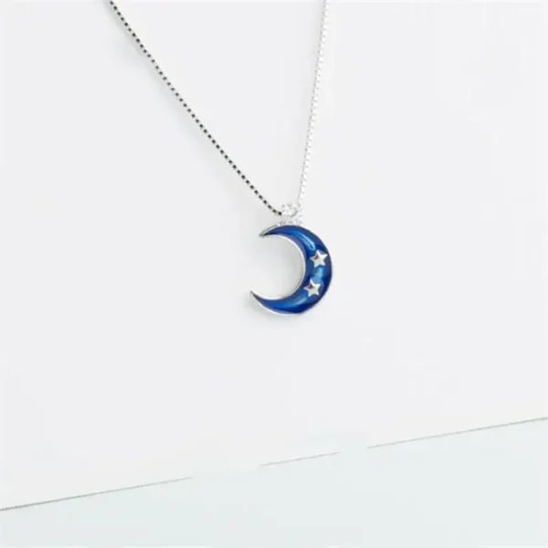 A celestial-themed necklace featuring a blue crescent moon with embedded stars, perfect for science lovers and astronomy enthusiasts.