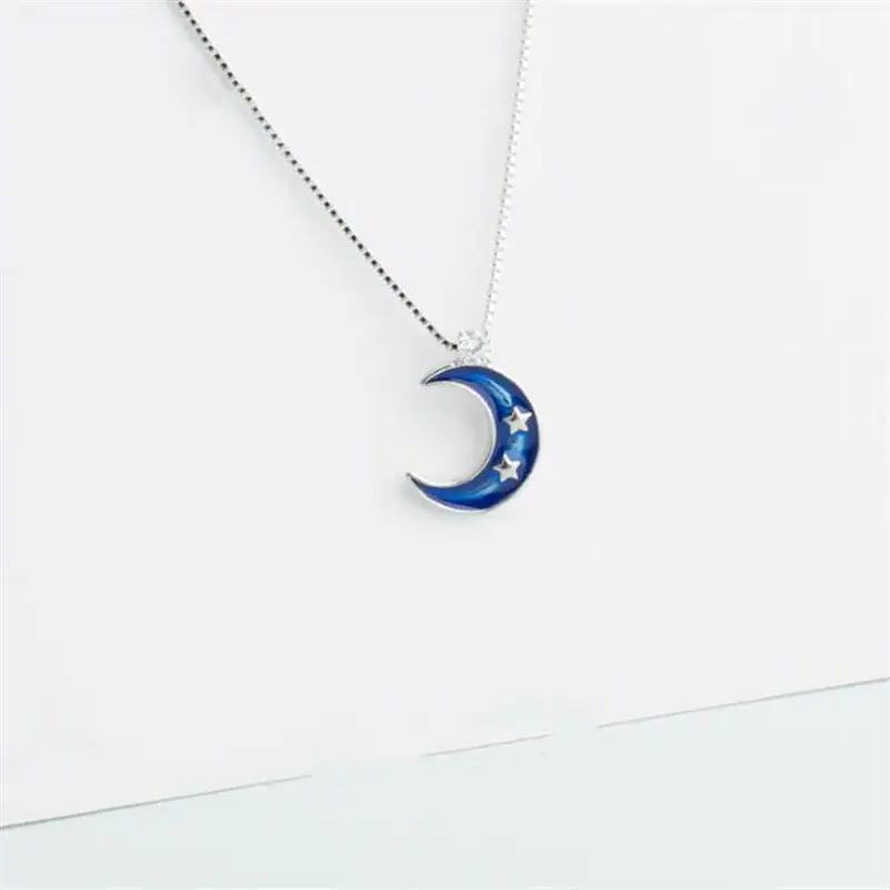 Moon and stars pendant necklace for science-themed jewelry and decor. A celestial-themed necklace featuring a blue crescent moon with embedded stars, perfect for science lovers and astronomy enthusiasts.
