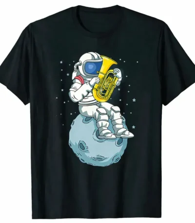 Fun space-themed T-shirt featuring an astronaut playing a tuba while sitting on a moon crater, surrounded by stars, perfect for science and space enthusiasts.