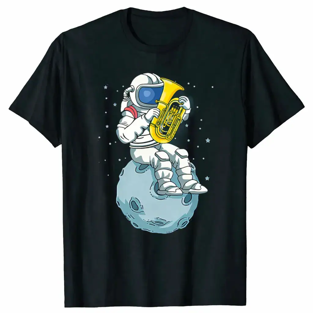 Fun space-themed T-shirt featuring an astronaut playing a tuba while sitting on a moon crater, surrounded by stars, perfect for science and space enthusiasts.