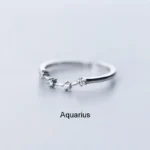 Elegant silver Aquarius zodiac ring with small sparkling stones, perfect for astrology enthusiasts and as a stylish jewelry accessory.