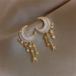 Elegant celestial-themed jewelry featuring crescent moon and star charms with sparkling rhinestones.