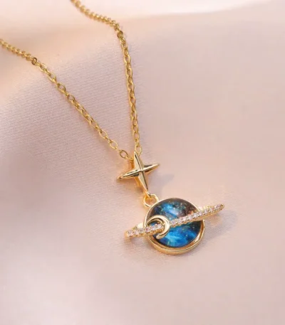 Elegant gold chain necklace featuring a celestial-themed pendant with a star, moon, and galaxy design, perfect for science and space enthusiasts.