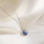 Elegant galaxy pendant necklace featuring a miniature starry night sky design. Perfect for science and space enthusiasts.
