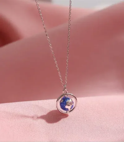 Elegant necklace featuring a small Earth globe pendant on a delicate silver chain, perfect for science lovers and educational jewelry enthusiasts.
