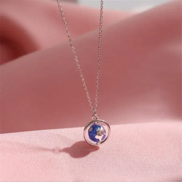 Elegant necklace featuring a small Earth globe pendant on a delicate silver chain, perfect for science lovers and educational jewelry enthusiasts.