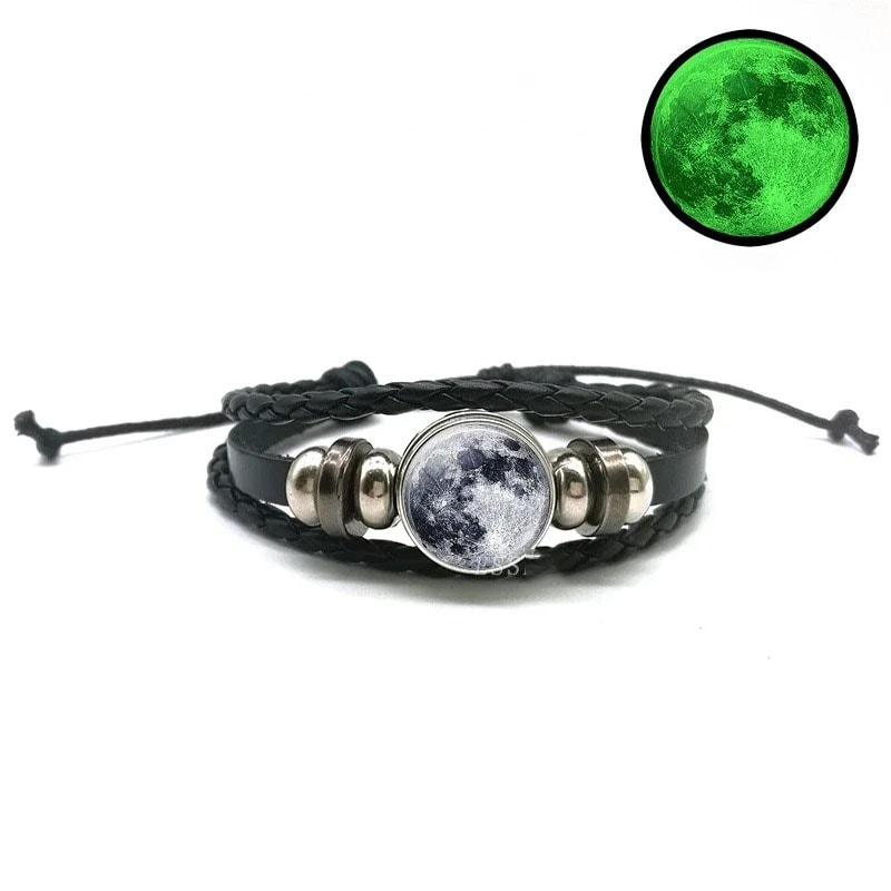 Moon and Earth bracelet with black leather bands and metallic accents, inspired by lunar and planetary themes.