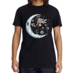 Black T-shirt featuring a colorful space-themed design with an astronaut floating among planets, stars, and a crescent moon. Perfect for science lovers and space enthusiasts.
