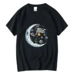 Black T-shirt featuring a colorful space-themed graphic with an astronaut, moon, planets, and stars, perfect for science and space enthusiasts.