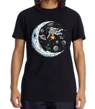 Black T-shirt featuring a colorful space-themed design with an astronaut floating among planets, stars, and a crescent moon. Perfect for science lovers and space enthusiasts.