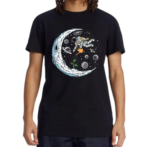 Black T-shirt featuring a colorful space-themed design with an astronaut floating among planets, stars, and a crescent moon. Perfect for science lovers and space enthusiasts.
