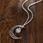 Elegant moon and star jewelry pendant on a delicate chain.