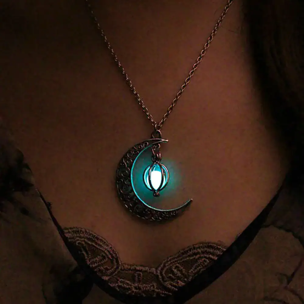 Mystical Moon and Lantern Necklace A glowing moon and lantern pendant necklace with a mystical design, perfect for fans of celestial and fantasy jewelry.