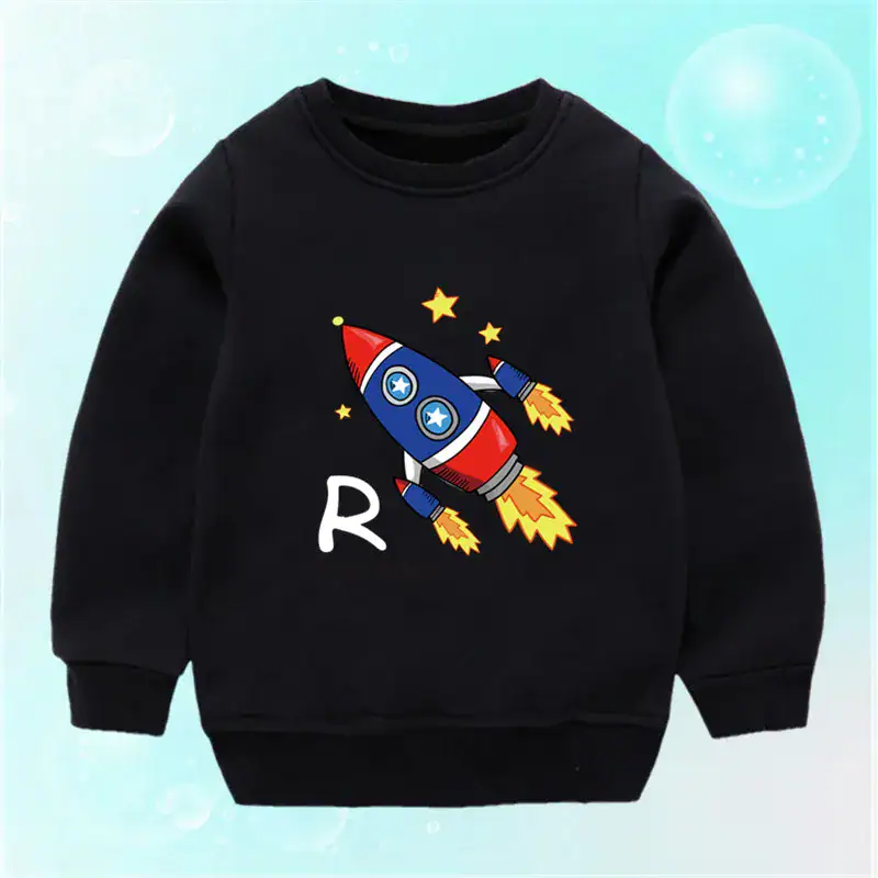 Black children's sweatshirt featuring a colorful cartoon rocket with stars, designed for science-themed decor and educational play.