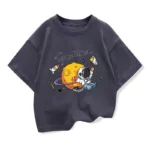 Adorable black T-shirt featuring a cartoon astronaut exploring space with a rocket, planets, and stars, perfect for young science enthusiasts and space lovers.