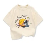 Cute children's T-shirt featuring a playful astronaut and rocket design with a space theme. Perfect for young science enthusiasts and space lovers.