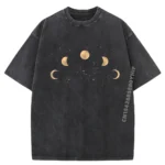 A black T-shirt featuring a design of the moon's phases, from new moon to full moon, arranged in a semi-circle across the chest.