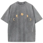 A stylish gray T-shirt featuring a detailed print of the moon's phases, perfect for science lovers and astronomy fans.