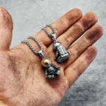 Silver astronaut and rocket pendants on chains, perfect for science-themed jewelry and educational gifts.