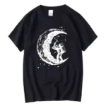 A black T-shirt featuring a white graphic of an astronaut planting a flag on the moon, with a detailed crescent moon in the background. Perfect for science enthusiasts and space lovers.