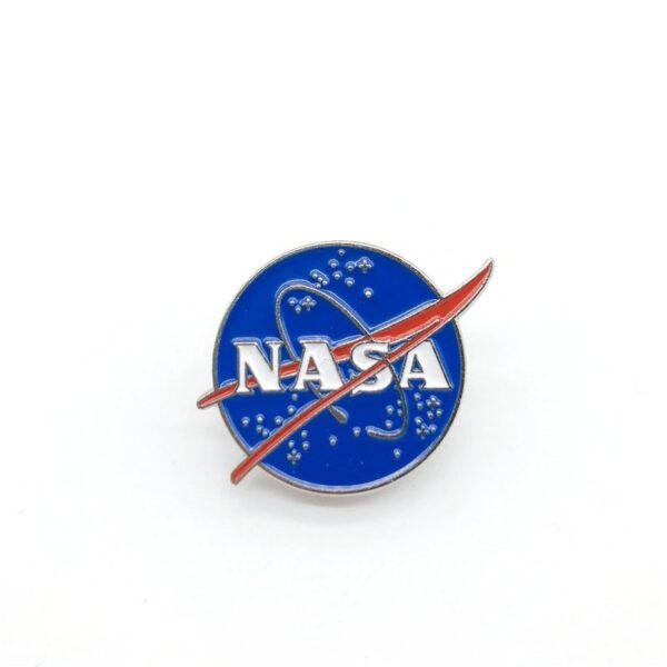 NASA logo pin featuring the iconic blue circle with white lettering and red swoosh, representing space exploration and science.
