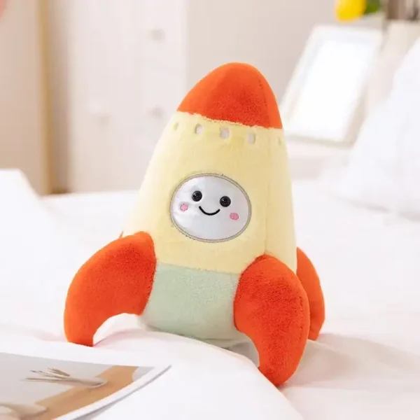Adorable rocket-shaped plush toy with a smiling face, designed for children. Perfect as a science-themed decor or educational toy to inspire curiosity and learning about space.