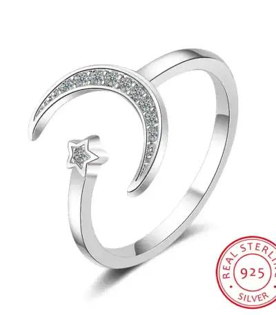 Elegant moon and star design silver ring with embedded cubic zirconia stones, perfect for celestial-themed jewelry collections.