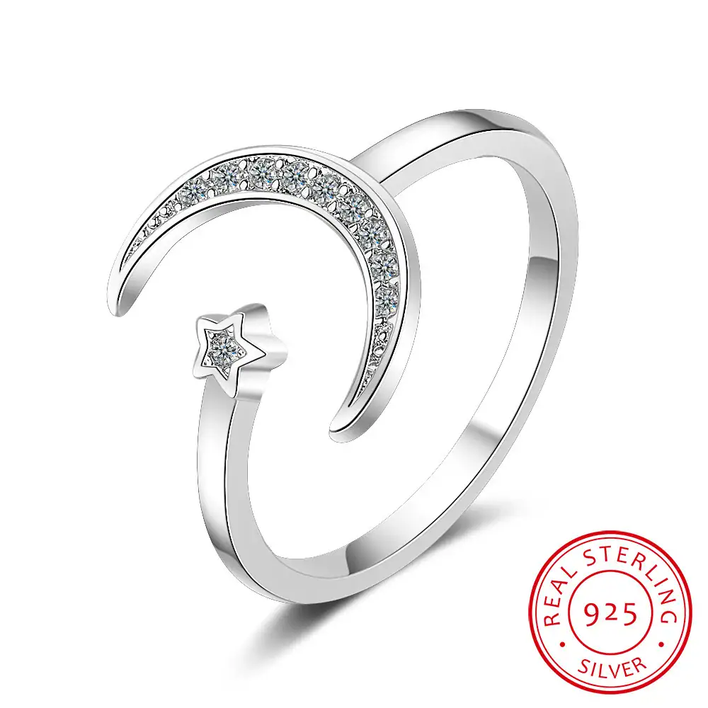 Elegant moon and star design silver ring with embedded cubic zirconia stones, perfect for celestial-themed jewelry collections.