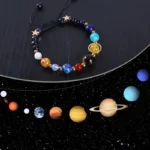 Colorful space-themed beaded bracelet featuring planet charms and star accents, perfect for science enthusiasts and educational decor.