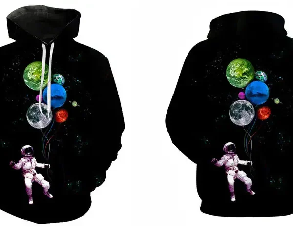 A hoodie featuring a space-themed design with planets and an astronaut holding balloons, perfect for science enthusiasts and educational decor.