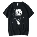 Astronaut holding a string attached to a moon illustration on a black T-shirt.