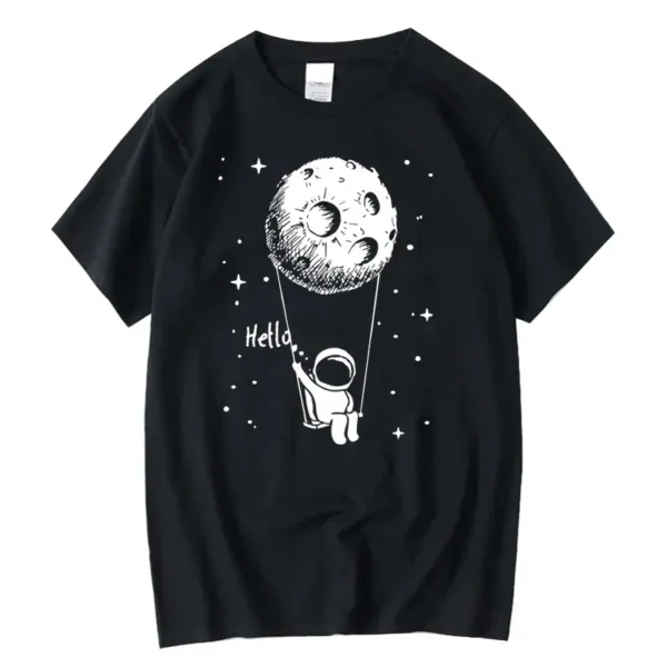Astronaut holding a string attached to a moon illustration on a black T-shirt.