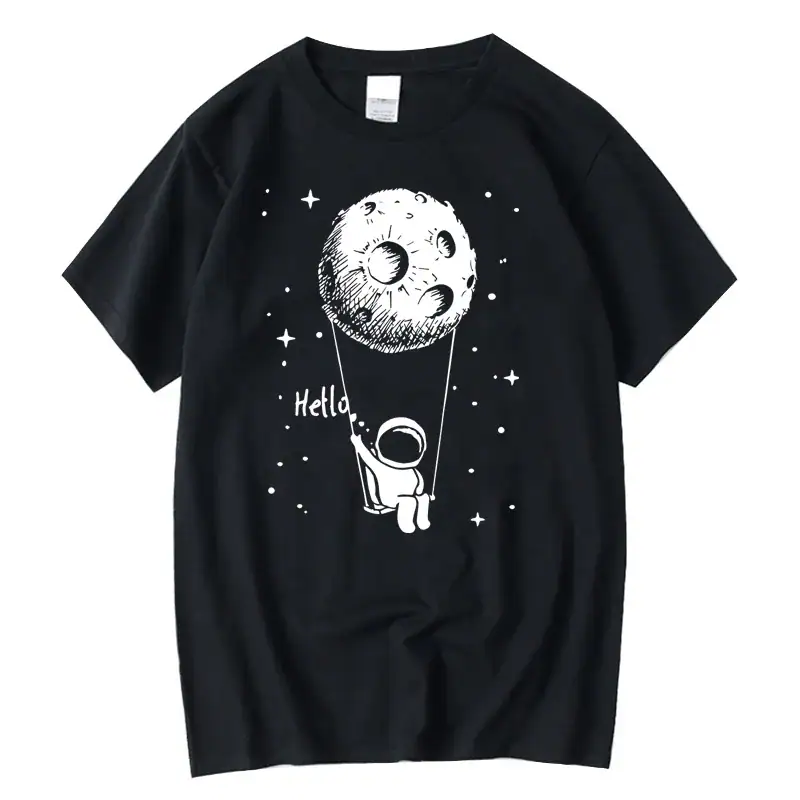 Astronaut holding a string attached to a moon illustration on a black T-shirt.