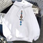 Bright white hoodie featuring a colorful, artistic print of planets and space objects along the front center. Perfect for science enthusiasts and space lovers.