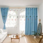 Bright children's room decorated with space-themed curtains featuring rockets, planets, and stars, creating an engaging and educational environment for kids.