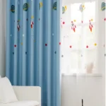 Space-themed window curtain featuring rockets, planets, and stars, perfect for a child's room or science-themed decor.