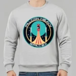 Comfortable grey sweatshirt featuring a colorful Falcon Heavy SpaceX rocket launch graphic, perfect for science enthusiasts and space fans.