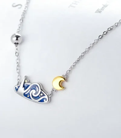 Elegant necklace featuring a starry night design with a crescent moon pendant, perfect for science and astronomy enthusiasts.