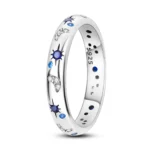 Astronomy-themed silver ring with blue and crystal accents.