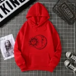 Bright red hoodie featuring a black sun and moon graphic, perfect for kids and teens who love celestial designs and comfortable casual wear.