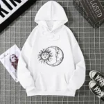 White hoodie featuring a black sun and moon graphic design, perfect for casual wear and science-inspired fashion statements.