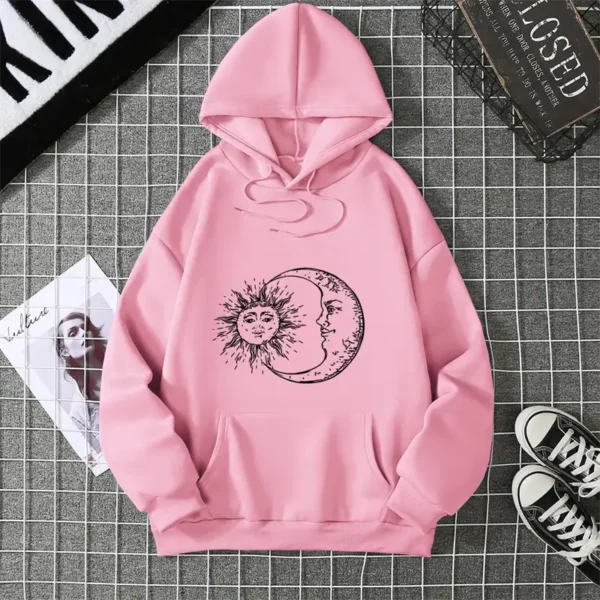Pink hoodie featuring a sun and moon graphic, perfect for teens and adults, casual wear, and cozy style.